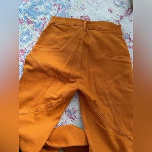 Never worn REVICE burnt orange flare pants with star detailing on back